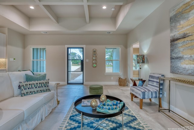 living room featuring beam ceiling and coffered ceiling