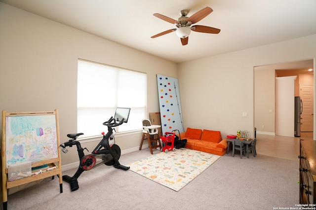 playroom featuring ceiling fan and carpet