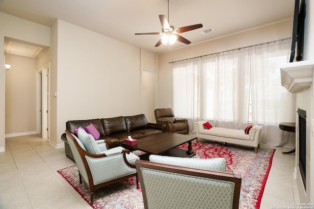 living room featuring ceiling fan and light tile patterned floors