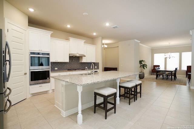 kitchen with sink, white cabinetry, a kitchen island with sink, and stainless steel appliances