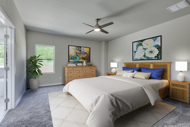 bedroom featuring light carpet, a textured ceiling, and ceiling fan