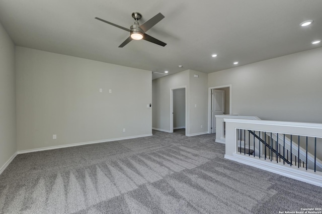 unfurnished room featuring carpet flooring and ceiling fan