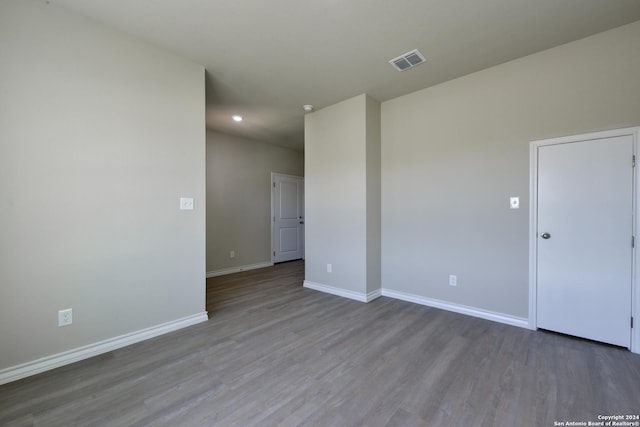 empty room featuring hardwood / wood-style flooring