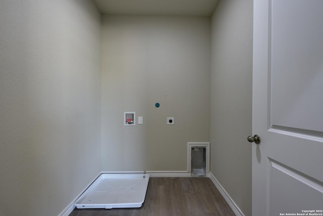 washroom with hookup for an electric dryer, hookup for a washing machine, and dark hardwood / wood-style floors