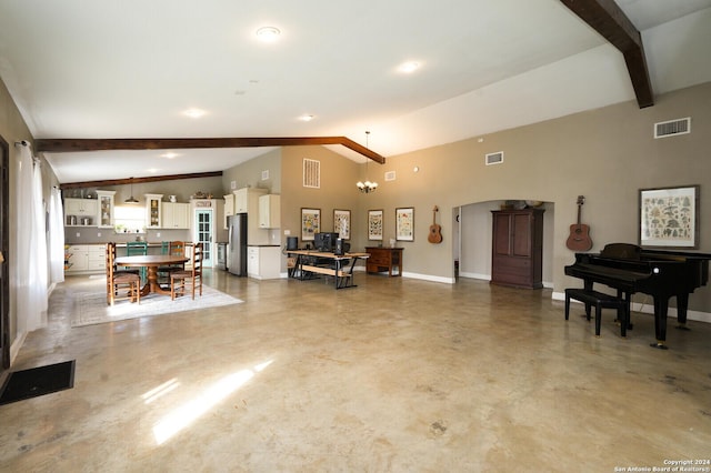 living room with vaulted ceiling with beams, concrete floors, and an inviting chandelier