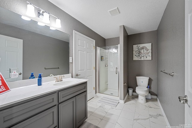 bathroom featuring vanity, a textured ceiling, toilet, and an enclosed shower