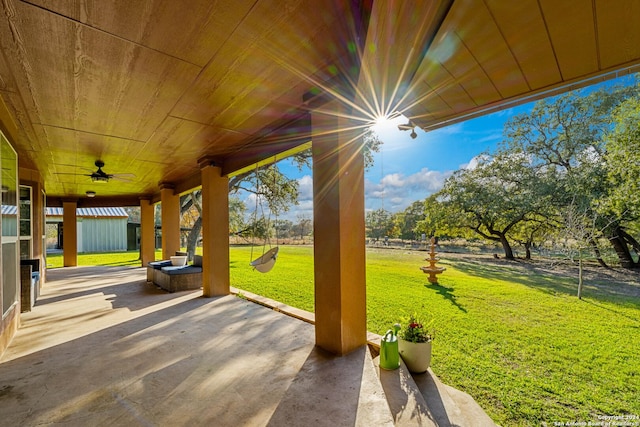 view of patio featuring ceiling fan