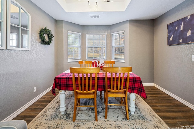 dining area with dark wood-type flooring