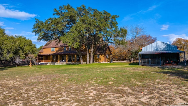 view of yard featuring covered porch