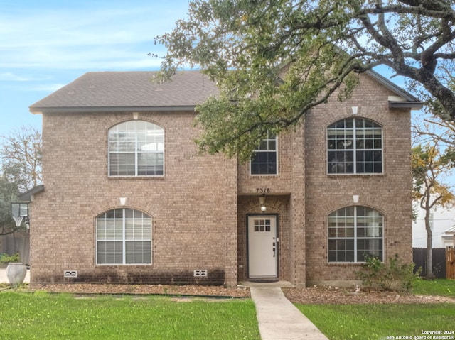 view of front of property with a front lawn