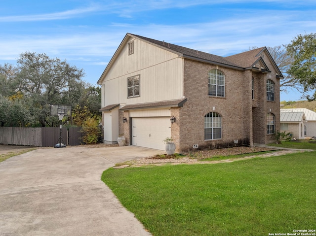 view of front of home with a garage and a front lawn