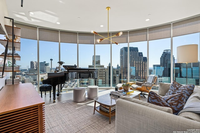 living room featuring hardwood / wood-style flooring and a wall of windows