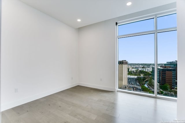 spare room featuring light hardwood / wood-style floors