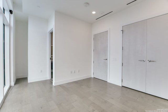 unfurnished bedroom featuring light hardwood / wood-style floors