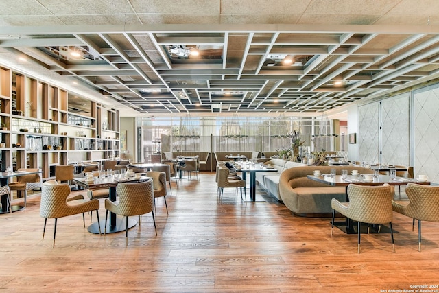 interior space with floor to ceiling windows and wood-type flooring