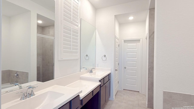 bathroom featuring vanity, tile patterned floors, and an enclosed shower