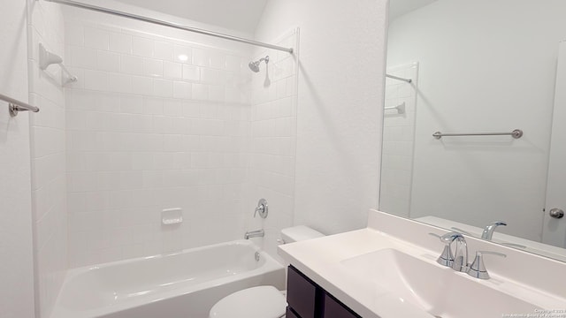 full bathroom with vanity, toilet, and tiled shower / bath