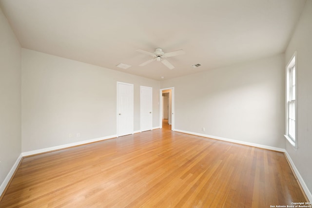 unfurnished room featuring ceiling fan and light hardwood / wood-style flooring