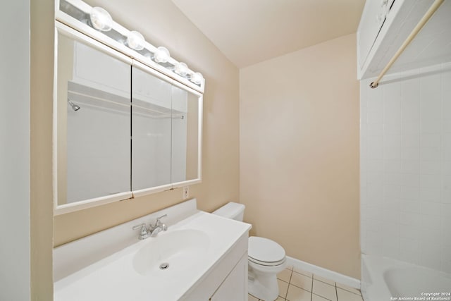 bathroom with tile patterned flooring, vanity, and toilet