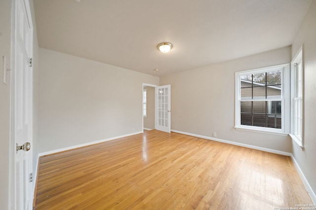 spare room featuring light hardwood / wood-style flooring