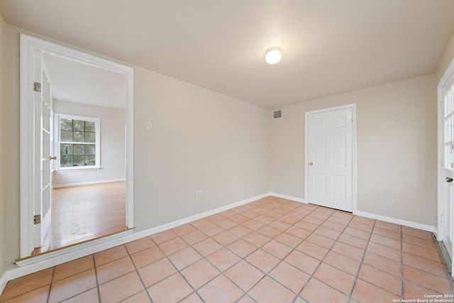 view of tiled spare room