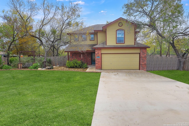 view of front of property featuring a garage and a front yard