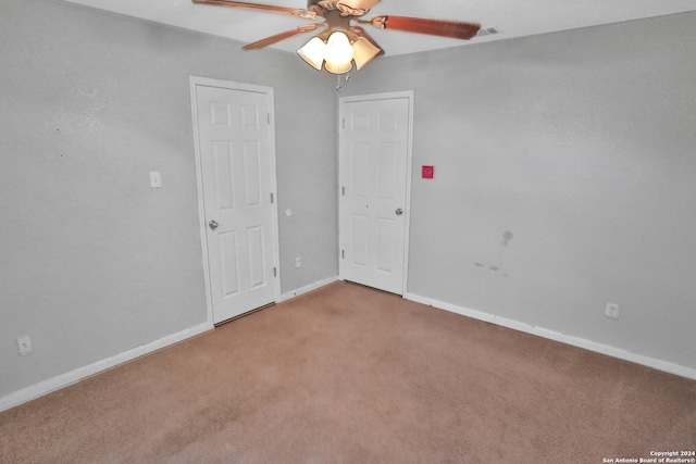 unfurnished bedroom with carpet and ceiling fan