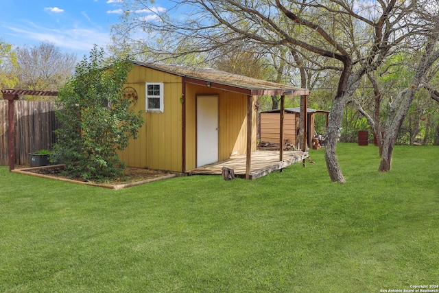 view of outbuilding featuring a yard