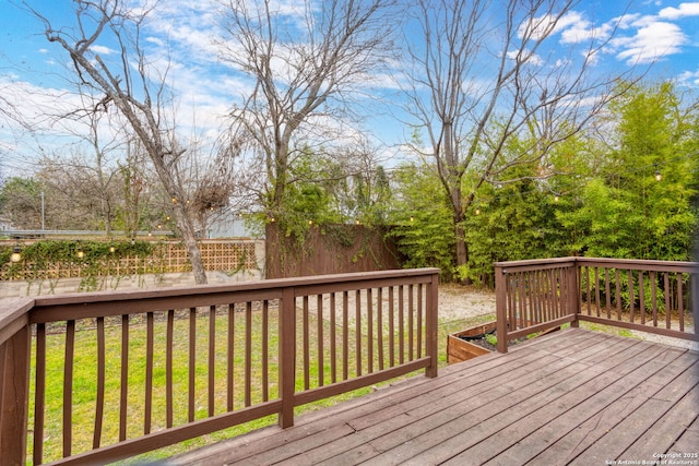 deck featuring a lawn