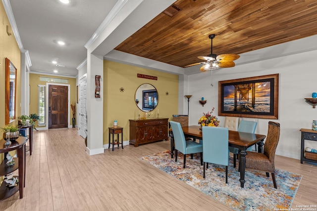 dining area with light wood-type flooring, ceiling fan, crown molding, and wood ceiling