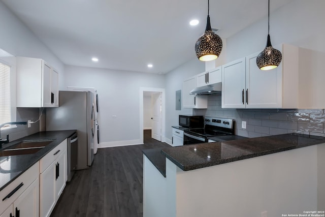 kitchen with decorative light fixtures, stainless steel appliances, white cabinetry, and sink