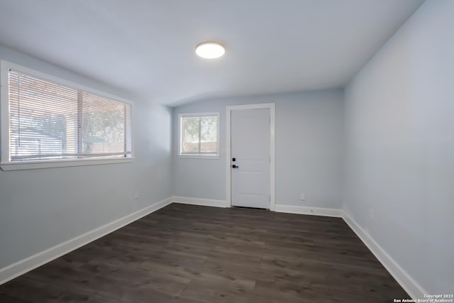 spare room with dark hardwood / wood-style floors