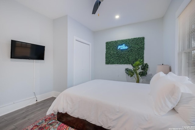 bedroom featuring ceiling fan and dark wood-type flooring