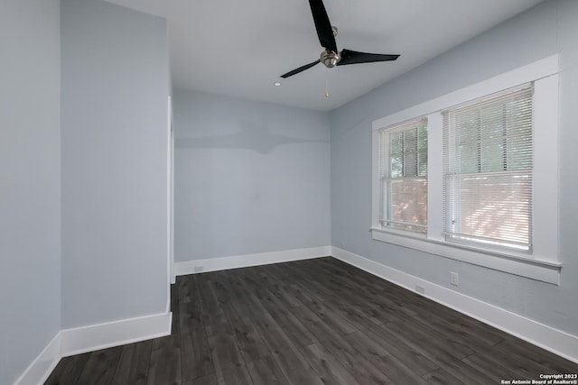 unfurnished room featuring dark hardwood / wood-style flooring and ceiling fan