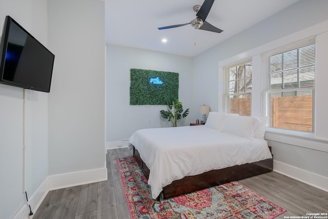 bedroom featuring hardwood / wood-style floors and ceiling fan