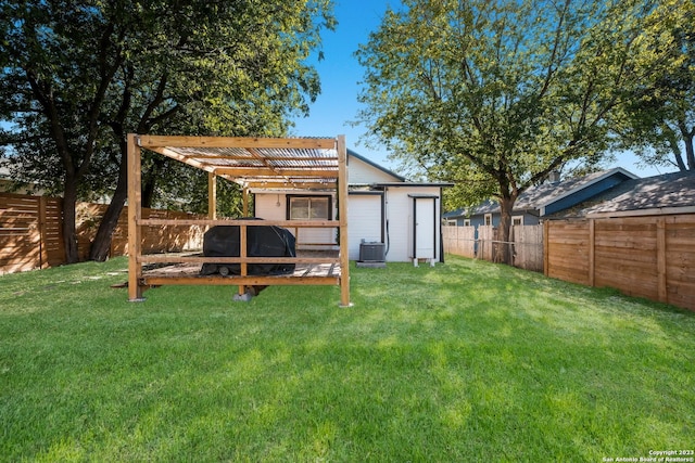 view of yard with an outbuilding and central AC unit