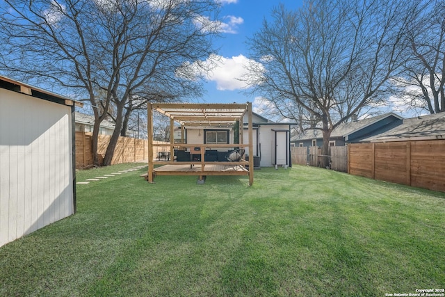 rear view of house featuring a pergola, a yard, and a deck