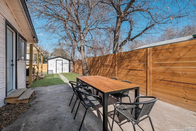 view of patio / terrace featuring a shed