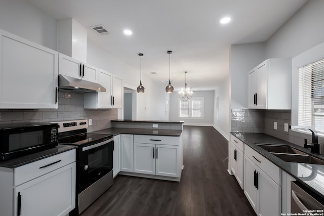 kitchen featuring kitchen peninsula, white cabinets, and stainless steel appliances