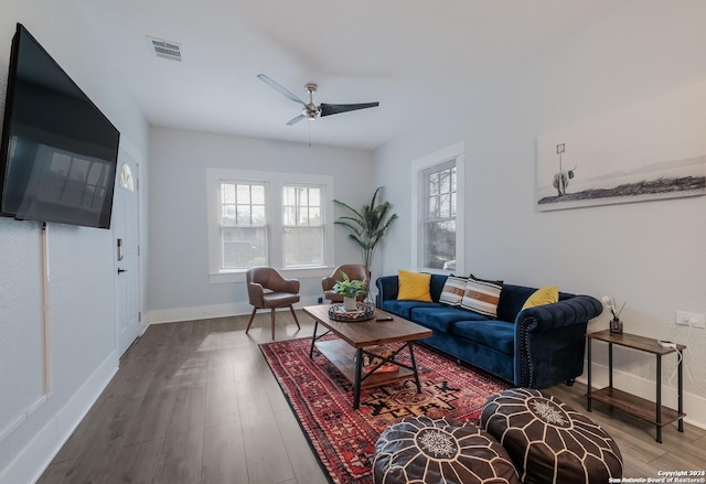 living room with hardwood / wood-style flooring and ceiling fan