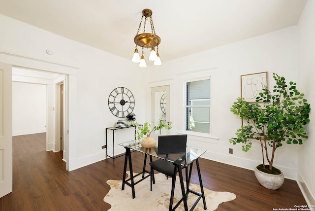 dining space with dark hardwood / wood-style flooring