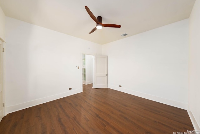 empty room featuring ceiling fan and dark hardwood / wood-style flooring