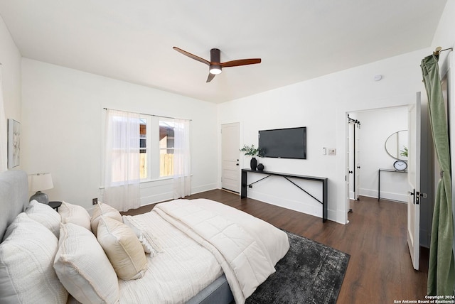 bedroom with ceiling fan and dark hardwood / wood-style flooring