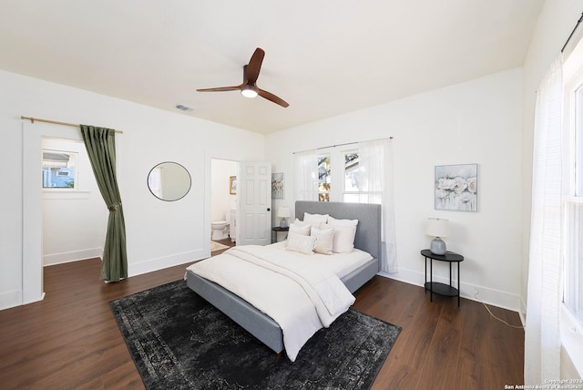 bedroom featuring ensuite bathroom, ceiling fan, and dark wood-type flooring