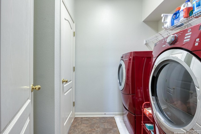 clothes washing area featuring washer and clothes dryer