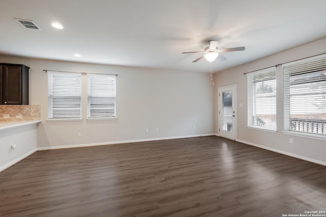 interior space with ceiling fan and dark wood-type flooring