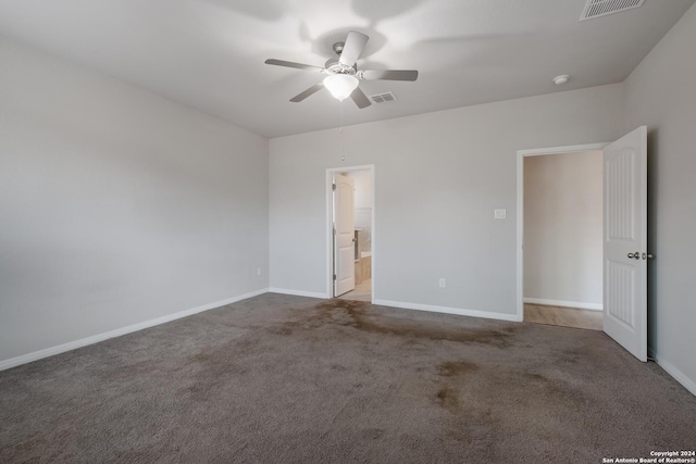 empty room featuring ceiling fan and light colored carpet