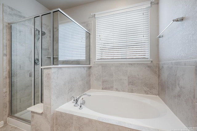 bathroom with independent shower and bath