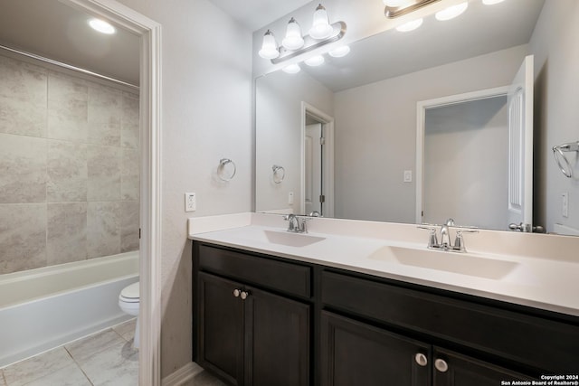 full bathroom featuring vanity, toilet, and tiled shower / bath