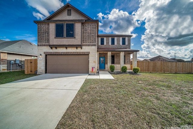 view of front facade featuring a garage and a front lawn